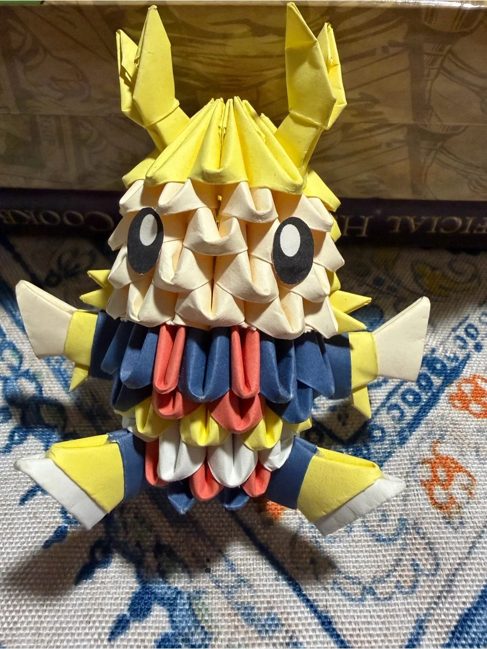 Preloved: 3D origami figure crafted using modular paper folding techniques.